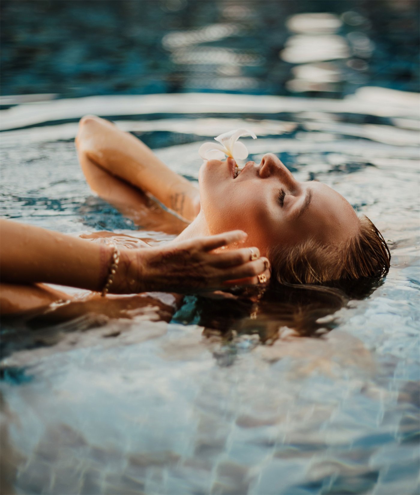 A woman floating in the spa pool